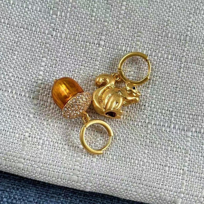 Gold squirrel and pine cone earrings