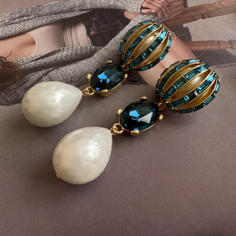 Hot air balloon crystal pearl earrings with blue crystals, green oval frames, and white drops