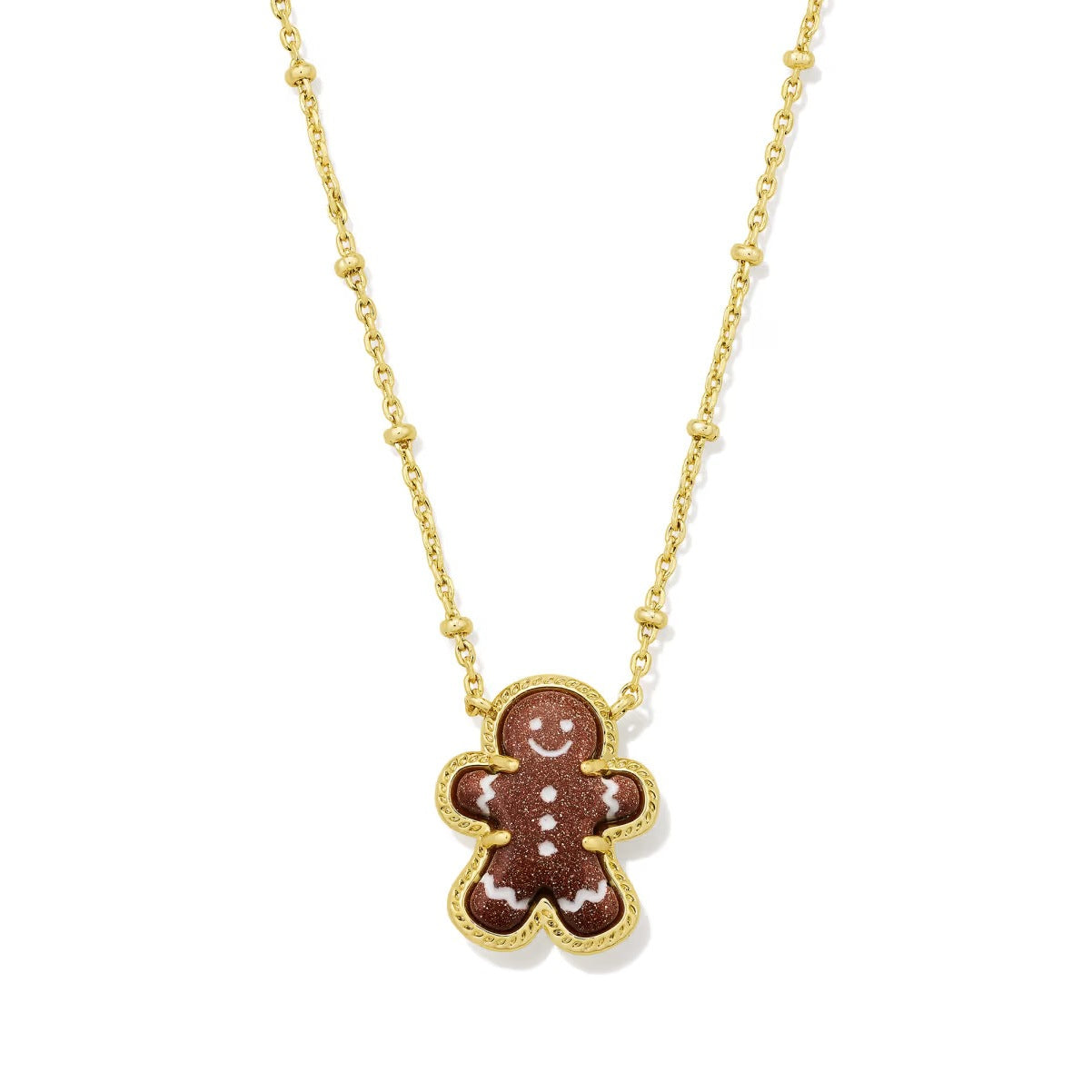 Gold gingerbread man pendant necklace with chain and enamel face details.