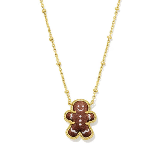 Gold gingerbread man pendant necklace with chain and enamel face details.