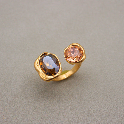 Adjustable open band gemstone ring with two large oval stones in smoky and peach