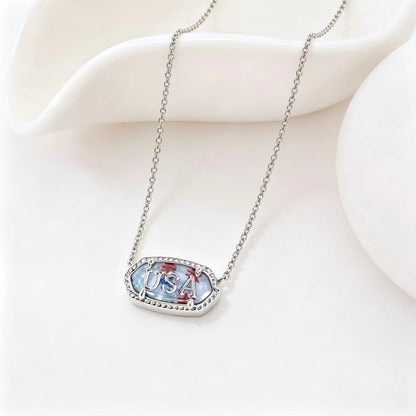 Silver-tone oval USA letter pendant necklace with blue enamel border