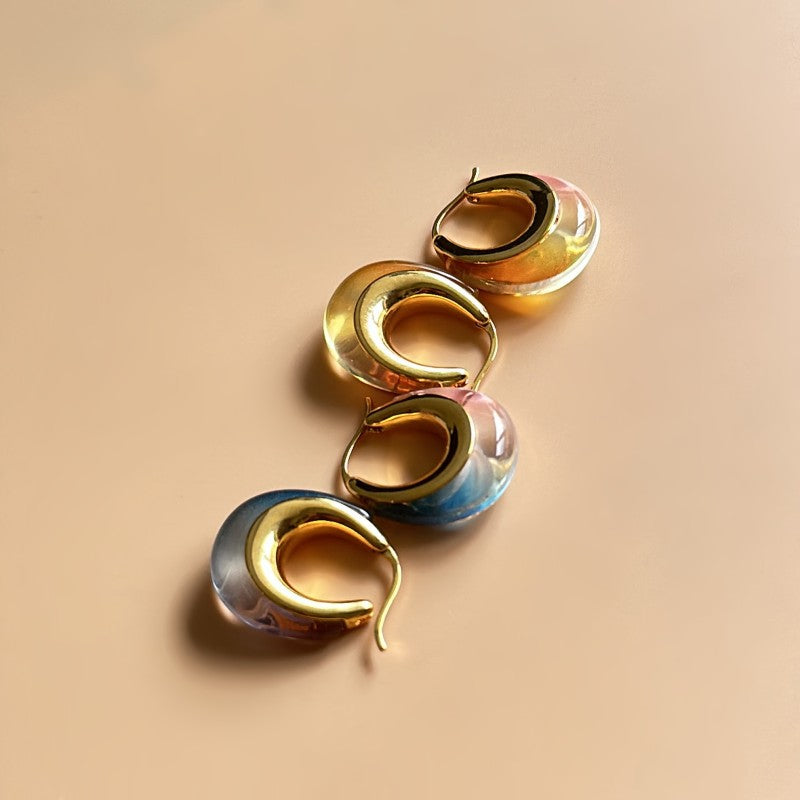 Ombré U-shaped hoop earrings, gold-tone edges; mixed amber, blue, and pink resin gradient