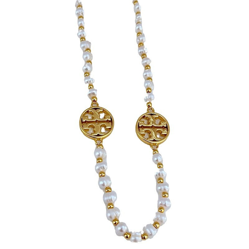 Tory Burch round hollow letter pearl sweater necklace