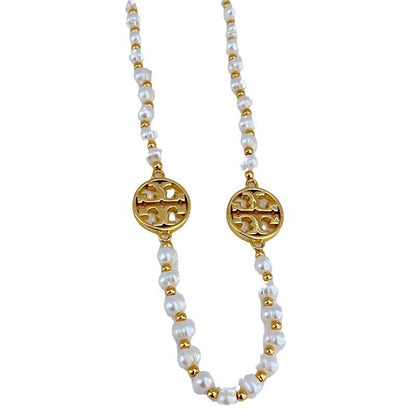 Tory Burch round hollow letter pearl sweater necklace
