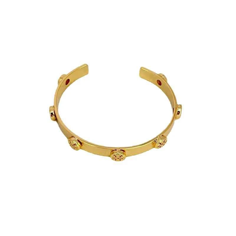 Tory Burch Embossed Metal Open Bangle Gold Color