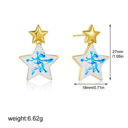 Gold-tone star statement earrings with blue marble swirl inlay