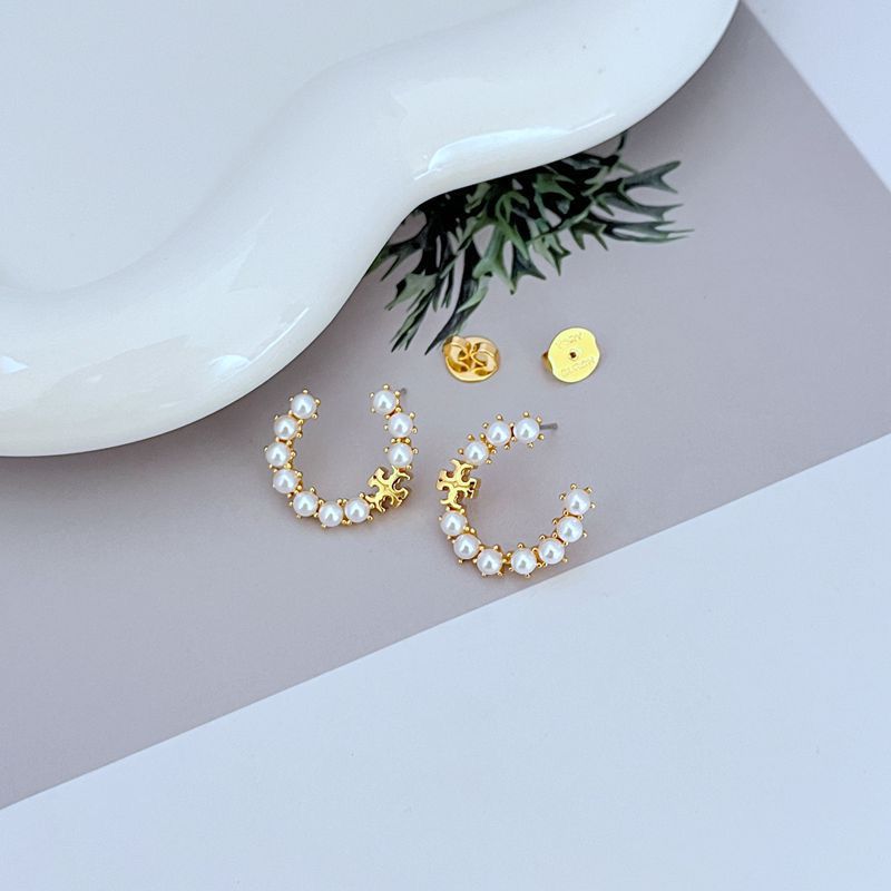 Gold pearl hoop earrings with white beads and small logo charm, pair view