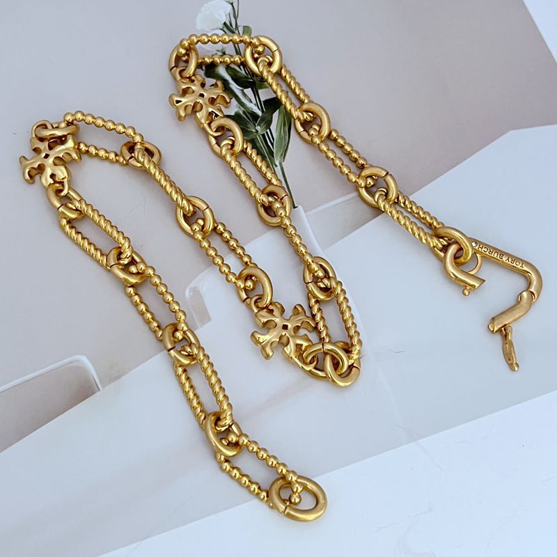 Gold square chunky chain logo bracelet with star-shaped emblem charm and chain extenders
