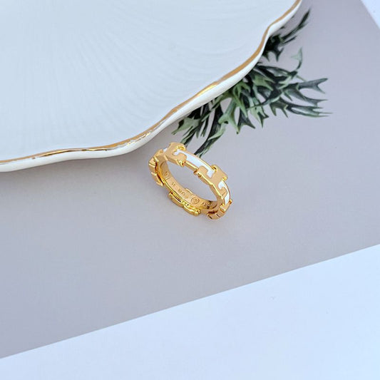 Gold enamel geometric circle metal ring with round open center and cutout band design