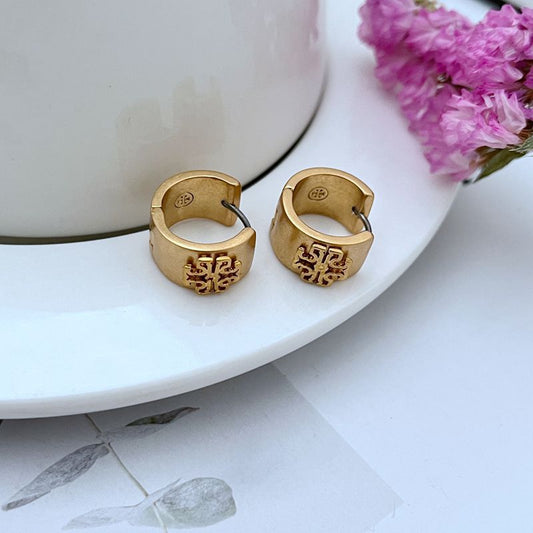 Matte wide-band logo hoop earrings, gold-tone metal with monogram detail