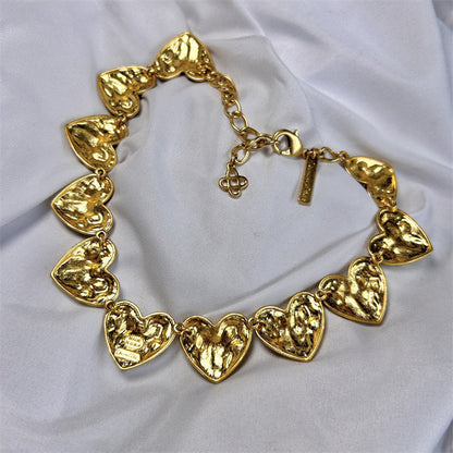 Vintage heart-shaped crystal necklace with gold chain and gold-tone faceted heart charms