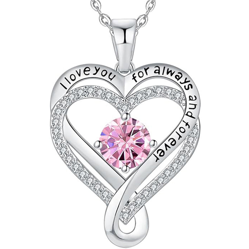 Silver heart pendant necklace with pink round gemstone and engraved heart message
