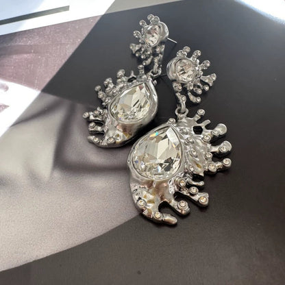 Silver-tone cactus crystal dangle earrings with clear teardrop gemstones and spiked detailing