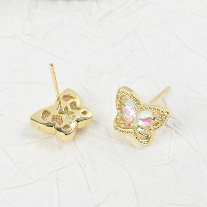 Gold butterfly stud earrings with iridescent multi-color stones, side view