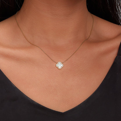 Clover mother-of-pearl pendant necklace on model neckline with gold-tone chain