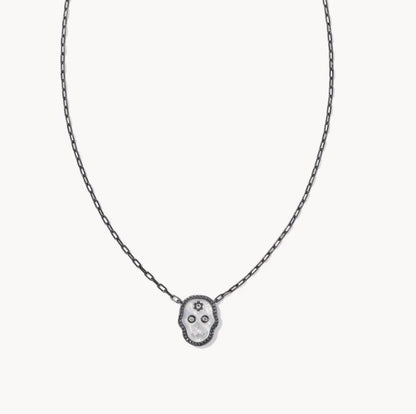 Dark-toned chain necklace with black skull pendant and white center