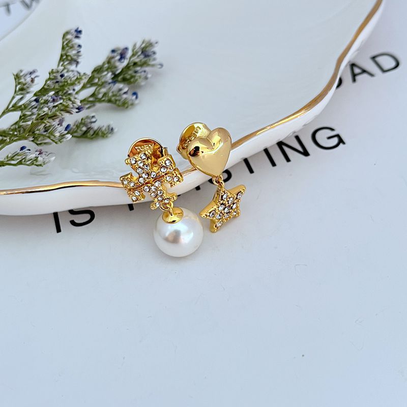 Gold-tone drop earrings with rhinestone star and heart charms plus white pearl