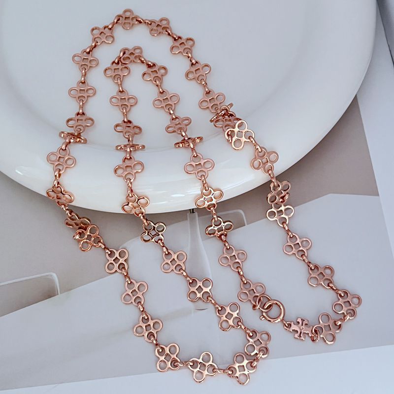 Four-leaf clover sweater chain necklace with rose-gold tone linked pendant drops