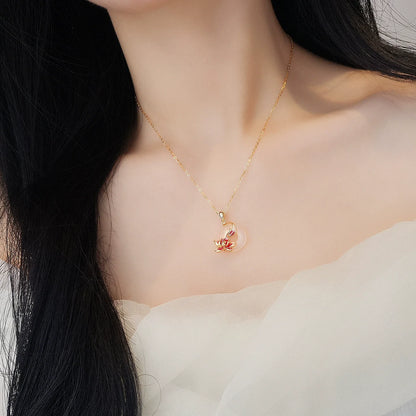 Gold-tone chain necklace with natural white chalcedony peace-knot flower pendant