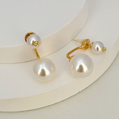 Gold-tone curved pearl drop earrings with large and small white pearls