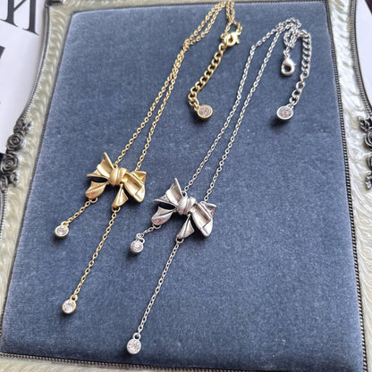 Bow crystal tassel necklace set: gold-tone and silver-tone styles with drops