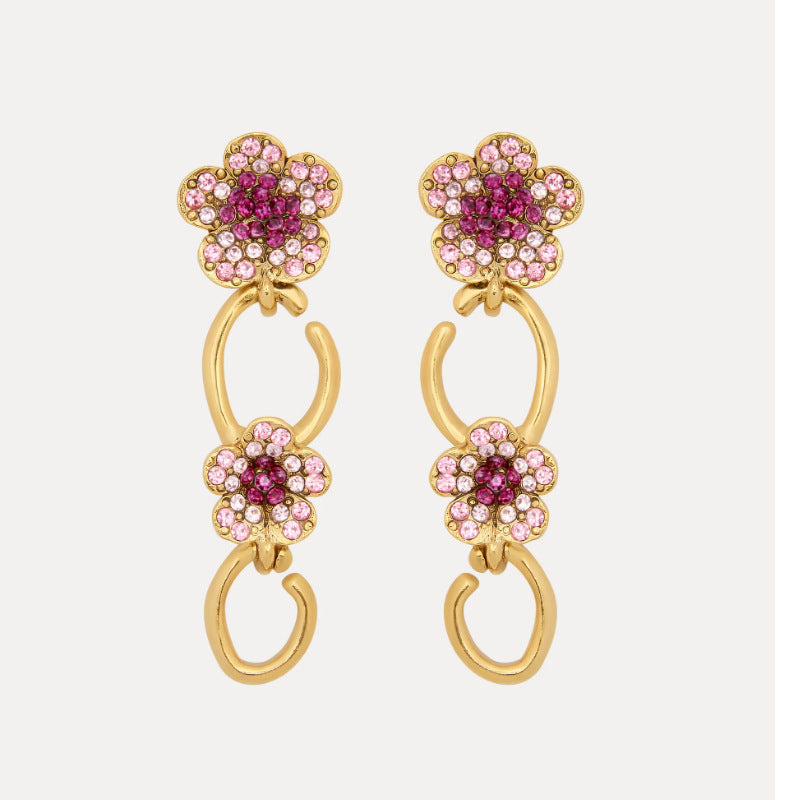 Floral dangle hoop earrings in gold tone with pink crystal flower clusters and loops