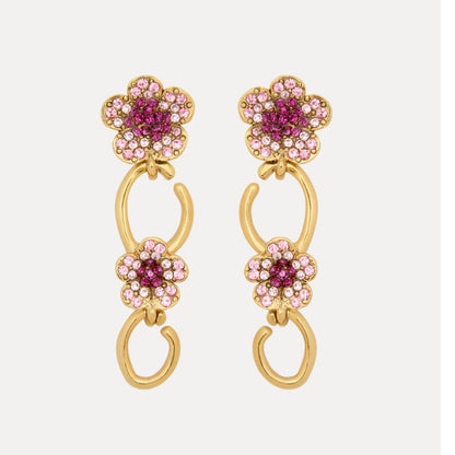Floral dangle hoop earrings in gold tone with pink crystal flower clusters and loops
