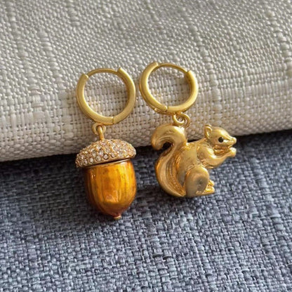 Gold squirrel and pine cone earrings