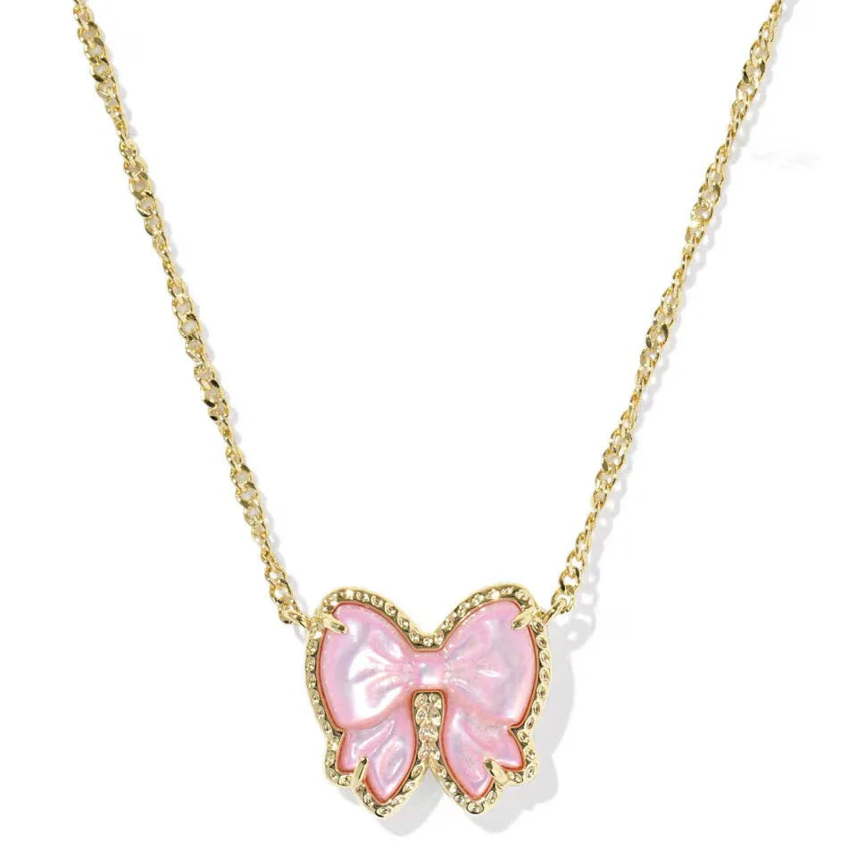 Gold-tone chain necklace with pink bow pendant studded with clear accents
