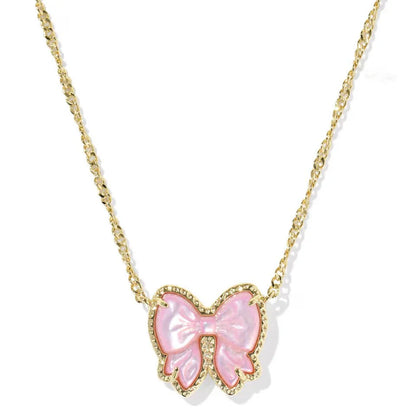 Gold-tone chain necklace with pink bow pendant studded with clear accents