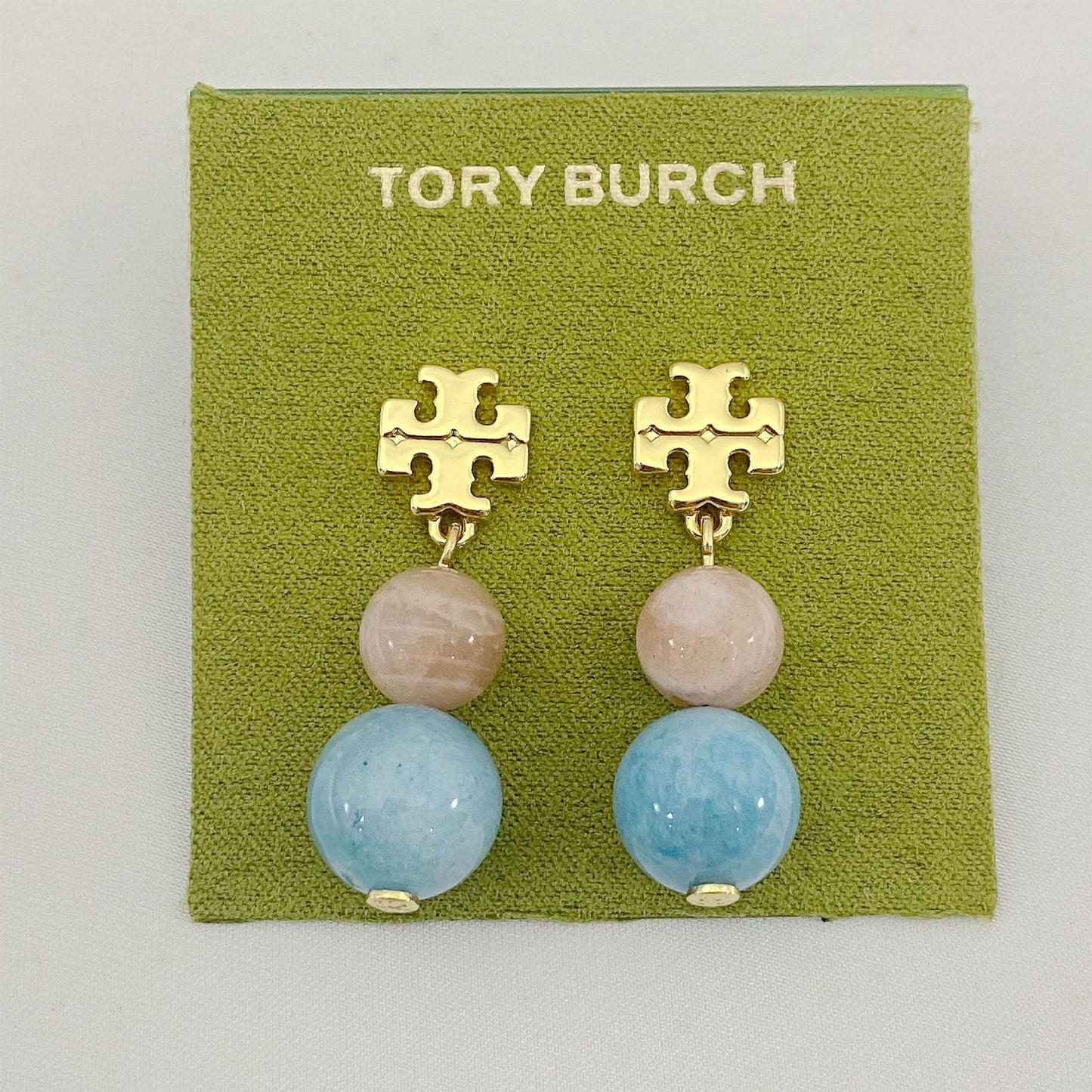 Tory Burch logo pendant earrings with pale pink and light blue agate beads