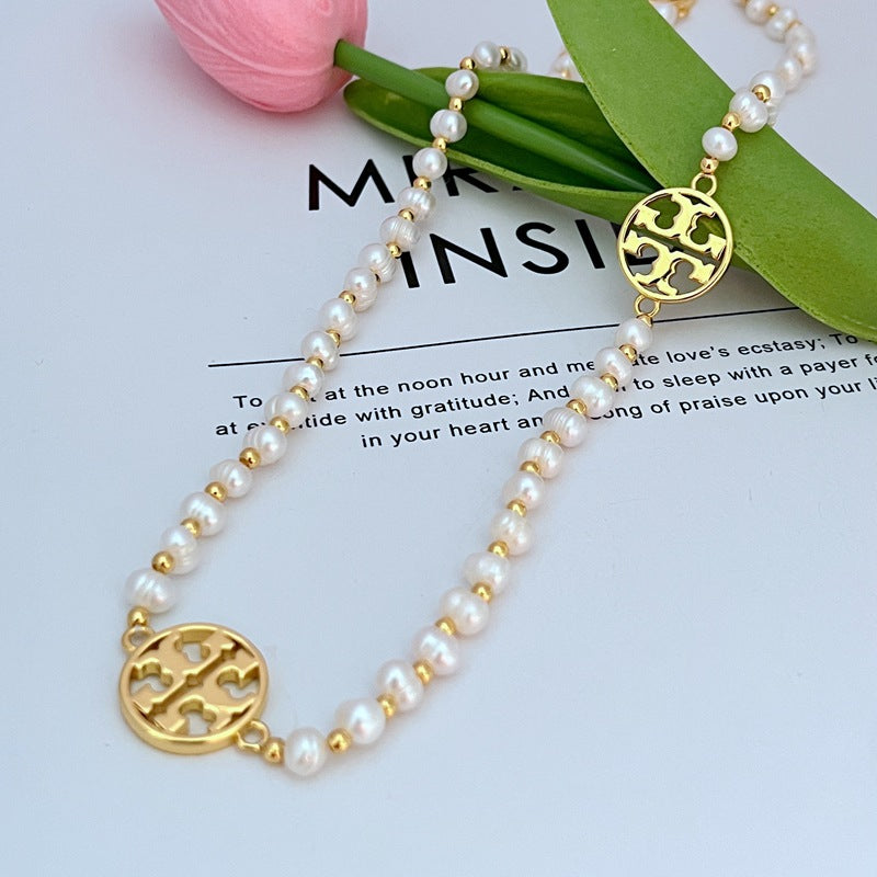 Tory Burch round hollow letter pearl sweater necklace