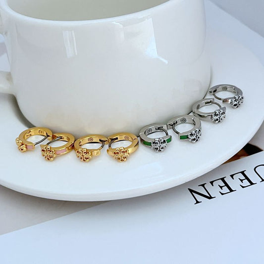 Geometric hoop earrings with gold and silver tones, green and pink enamel accents