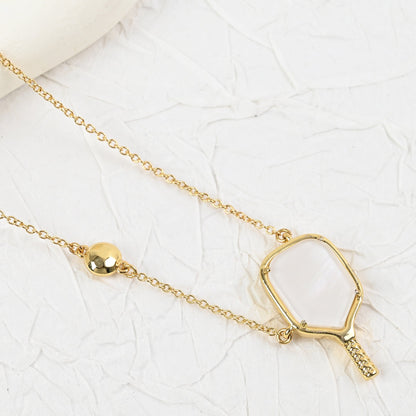 Gold tennis racket pendant necklace with hexagon-framed racket handle detail