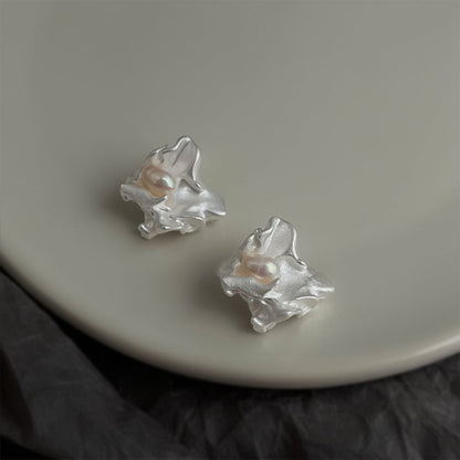 Silver irregular freshwater pearl stud earrings with petal-like settings