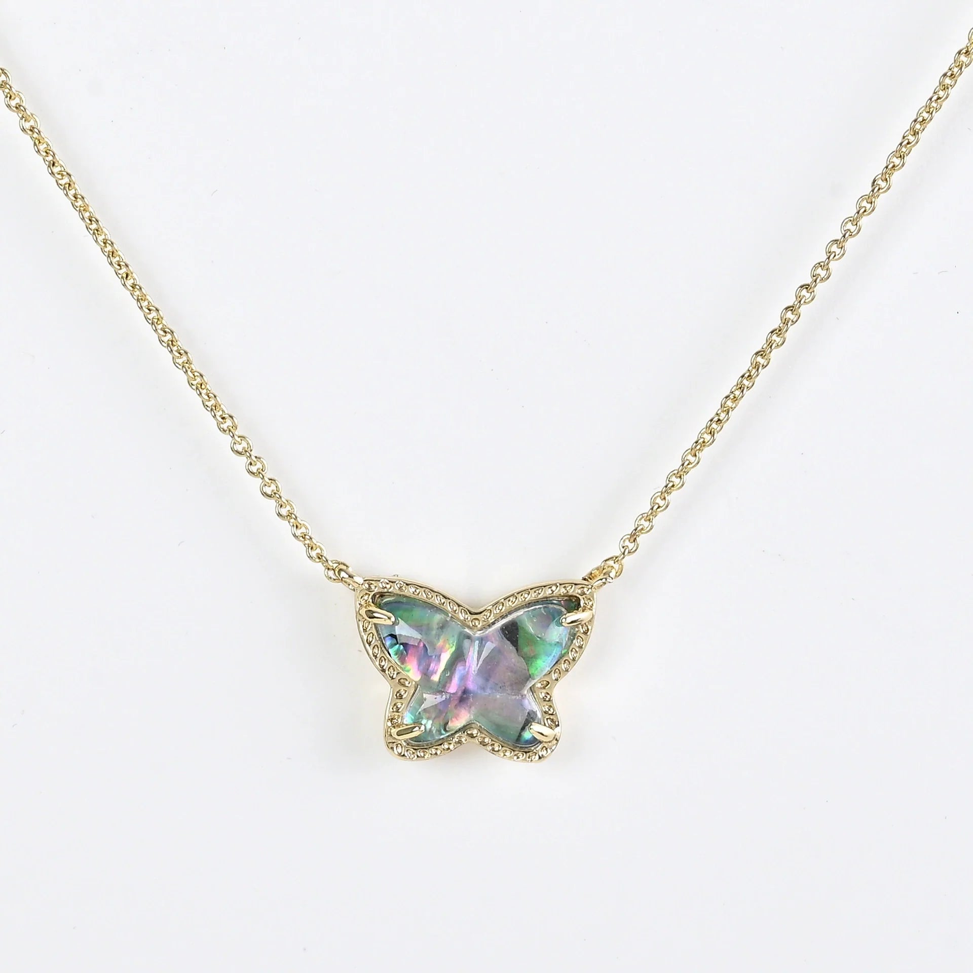 Gold butterfly pendant necklace with iridescent multi-color AB stone