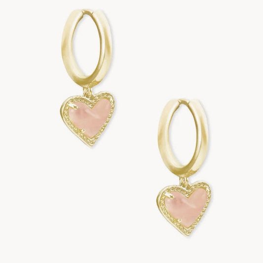 Gold heart pendant hoop earrings with pale pink stone and heart bezel detail