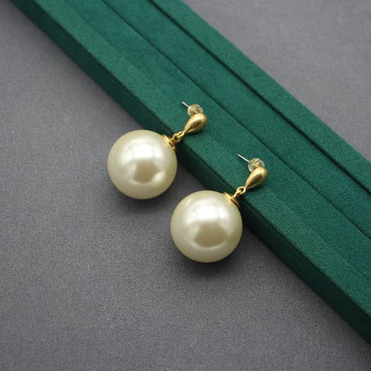 Gold faux-pearl drop earrings with large ivory spheres and hoop connectors
