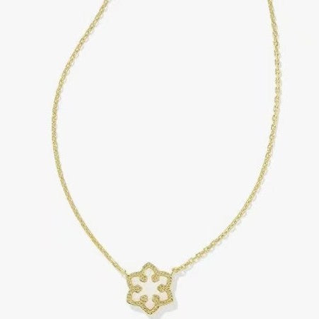 Gold-plated necklace with small snowflake charm pendant on gold chain