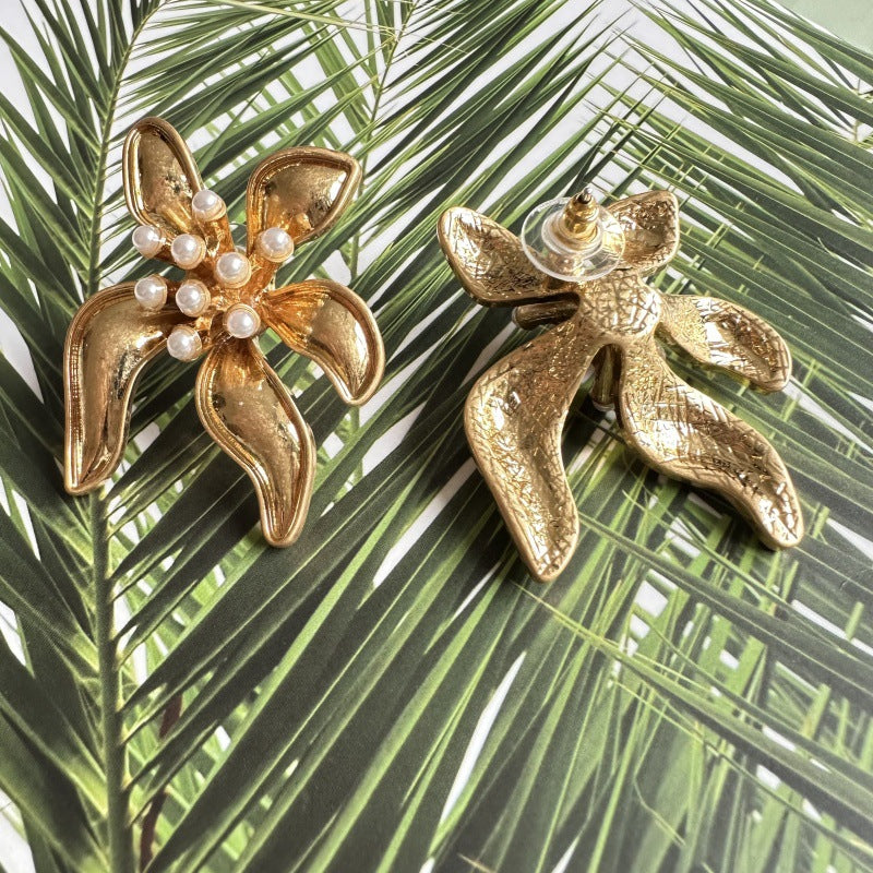 Floral enamel earrings with gold petal shapes and pearl bead details