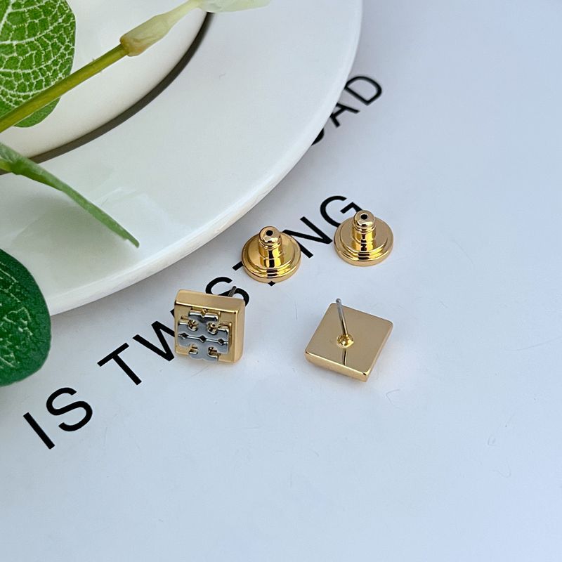 Square logo metal stud earrings with gold-tone backs and post closures