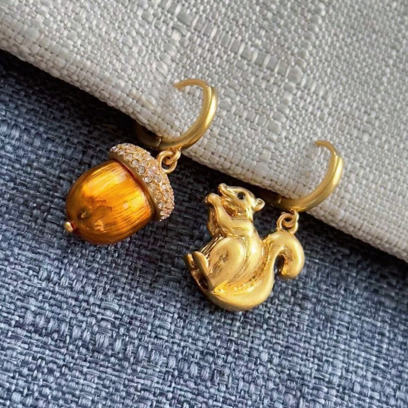 Gold squirrel and pine cone earrings