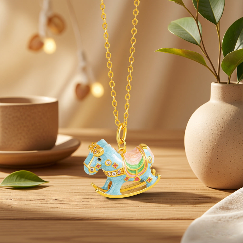 Enamel rocking horse pendant with blue horse charm on gold chain