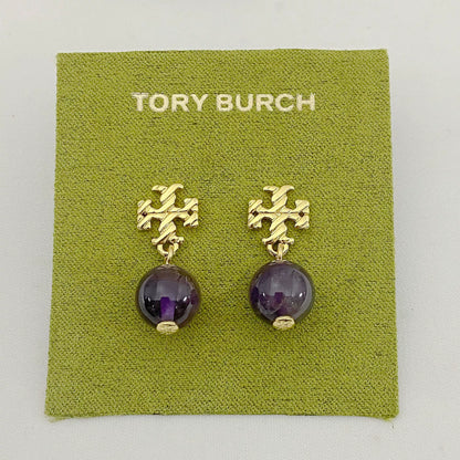 Gold-tone agate pendant earrings with round purple stones and leaf-like top motif