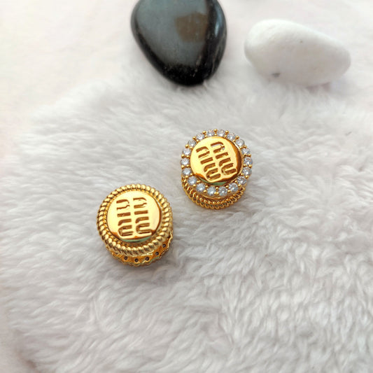 Round enamel stud earrings with golden logo center and crystal halo, with backs