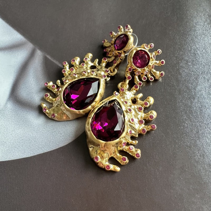 Gold-plated cactus crystal dangle earrings with purple teardrop gemstones and pink stud accents