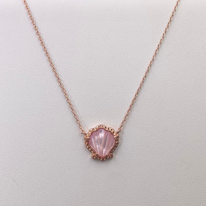 Rose gold-tone scallop pendant necklace with pink mother-of-pearl shell center