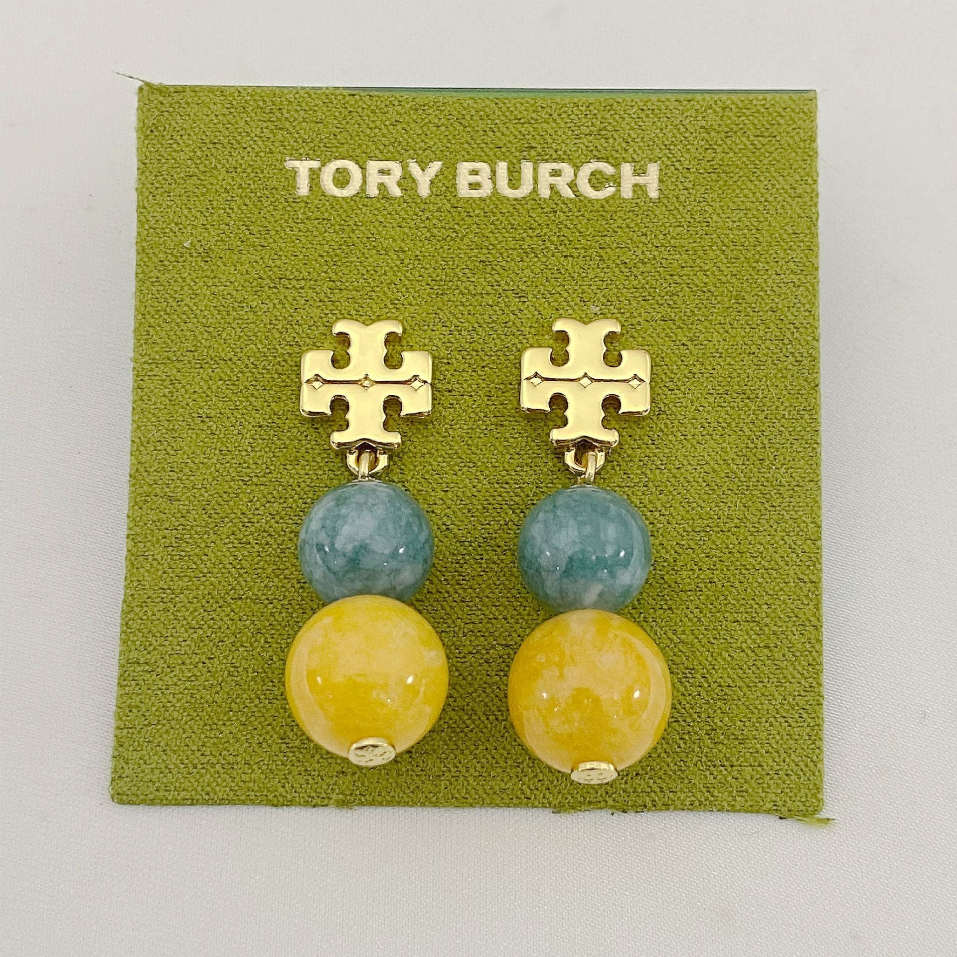Tory Burch logo pendant earrings with blue and yellow agate beads and gold logo
