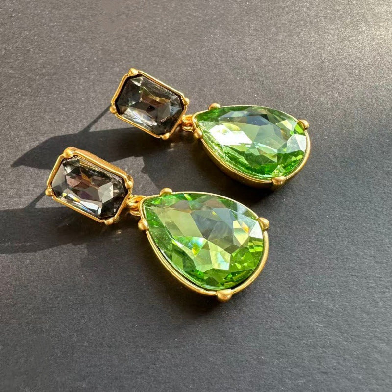 Teardrop-cut diamond stud earrings with green teardrop stones and smoky square accents, gold-tone